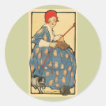 Arte Nouveau - chica que hace punto con su gato Etiquetas