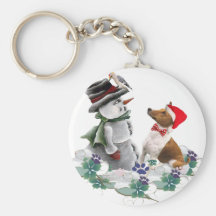 Basenji mira los regalos del muñeco de nieve llaveros