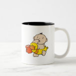 Bebé de la playa con el pato taza de café