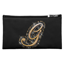 Bolso cosmético negro con G inicial
