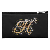 Bolso cosmético negro con H inicial