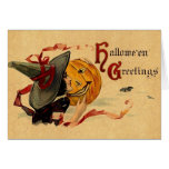 Bruja de Halloween del vintage con las cintas roja Felicitaciones