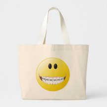 Cara del smiley de los apoyos bolsas