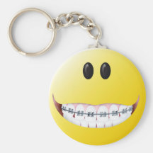 Cara del smiley de los apoyos llaveros