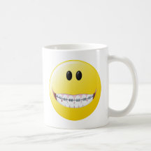 Cara del smiley de los apoyos taza