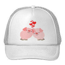 Cerdos lindos del dibujo animado en gorra del amor