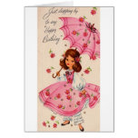 Chica del vintage en rosa con la tarjeta de cumple