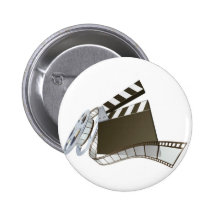 Clapperboard de la película y carrete de la pelícu pins