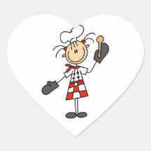 Cocinero de sexo femenino con los mitones y la cuc colcomanias corazon