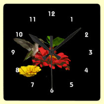 Colibrí en Zinnias reloj de pared