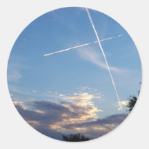 Cruz en los pegatinas de la puesta del sol