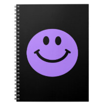 cuaderno sonriente púrpura de la cara
