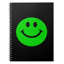 cuaderno sonriente verde de la cara