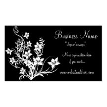 Diseño floral blanco en tarjetas de visita negras