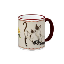 Dos tazas de los gatos siameses