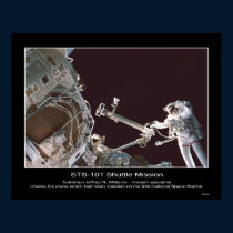 El astronauta Jeffrey N. Williams comprueba la grú posters