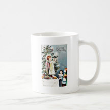 El navidad que saluda con un ángel deja el fuego e taza de café