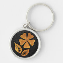 Flor de oro en el cuero negro llavero personalizado