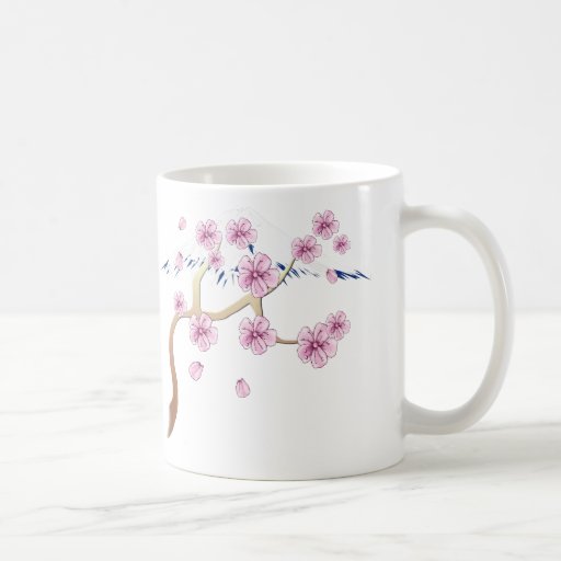 Flores de cerezo y taza del monte Fuji