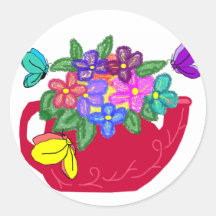 Flores de lujo en pote del té con los pegatinas de