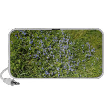 Flores e hierba púrpuras bonitas altavoces de viaje