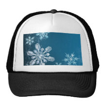 Fondo azul del copo de nieve del navidad gorros  