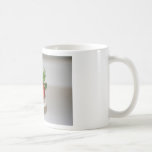 Fresa y una taza del mollete