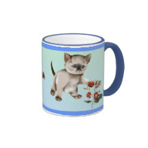 Gatito siamés CONTRA la taza de la mariquita