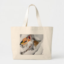 Goldfinch en nieve bolsa