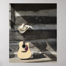 Gorra de vaquero en la guitarra que se inclina en  posters