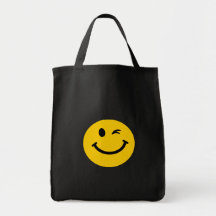 Guiño de la cara sonriente bolsas