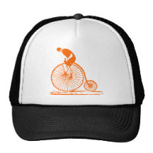 Hombre en un comino del penique - naranja gorros  
