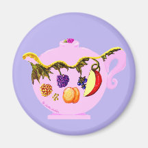 Imán de la tetera con la fruta y las hojas