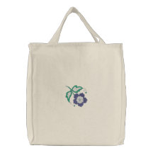 La bolsa de asas bordada violeta