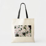 La bolsa de asas con los flores blancos de la flor