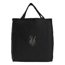 La bolsa de asas del monograma U de las flores