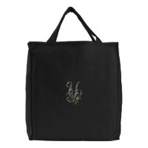 La bolsa de asas del monograma Y de las flores