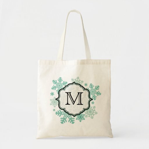 La bolsa de asas negra y azul del monograma del co