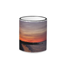 La salida del sol taza de café