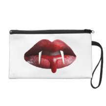 Labios rojos del lápiz labial del vampiro sangrien