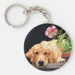 Llavero del golden retriever con la flor