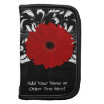 Margarita roja brillante del Gerbera en negro Organizador