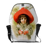Maud Humphrey: Chica del invierno con las bolas de bolsas messenger