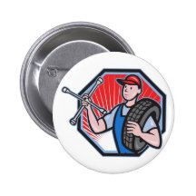 Mecánico con la llave y el neumático de zócalo del pins