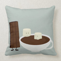 Melcochas y barra de chocolate sonrientes con los  cojines