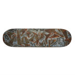 Monopatín anaranjado de la pintada del Grunge