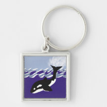 Natación de la ballena en el océano llaveros
