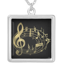 Notas musicales de oro en forma oval joyeria