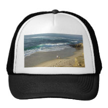 Ondas de arena de la playa del océano de la ensena gorros  