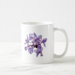 Orquídeas púrpuras con rocío taza